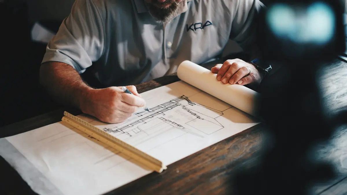 Architect drawing a floor plan by hand